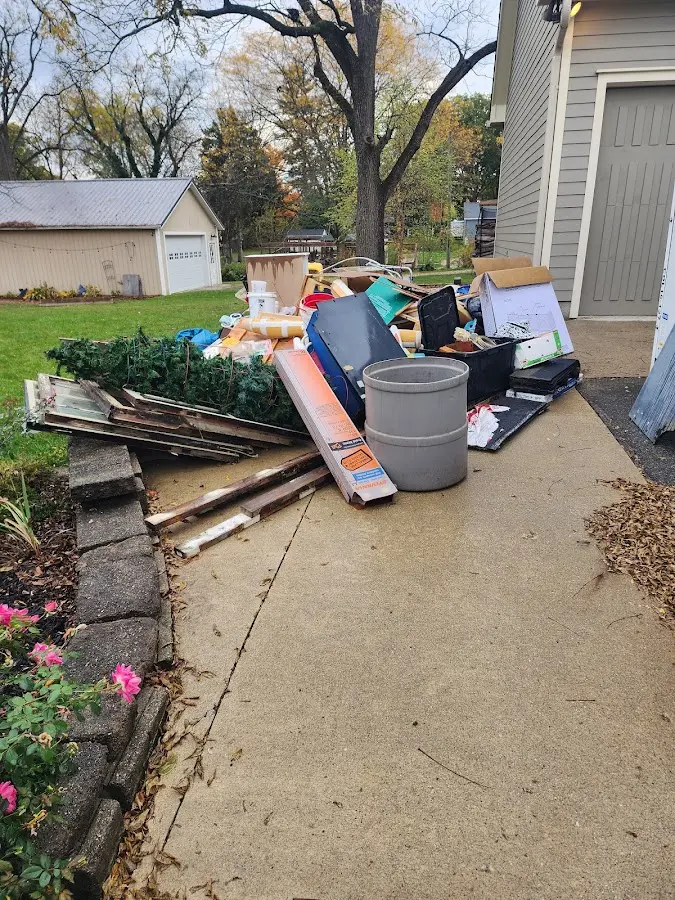 Dumpster being loaded with debris for Roofing Dumpster Rental in Souderton